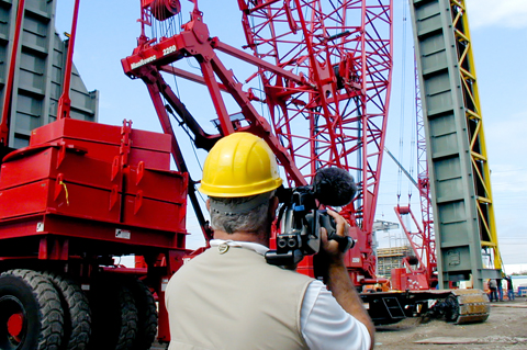 Video production director Mike Weber on location at a power plant construction site for a business video production in Tampa, FL